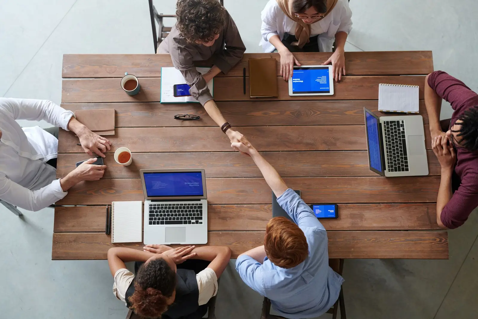 People collaborating across different business roles